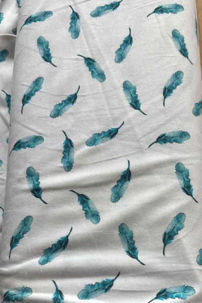 Jersey Baumwolle Bio Fb. weiß mit türkis-blauen Federn